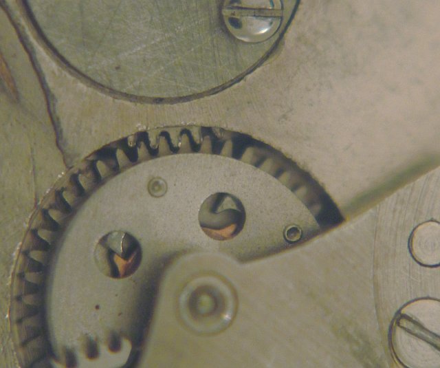Oscillating weight in contact